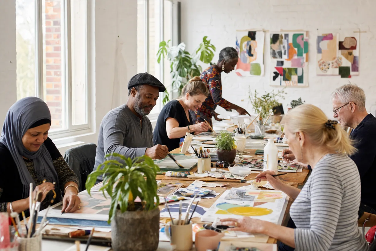 Community members creating art together at a workshop